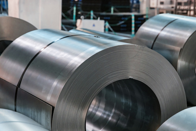 a572 vs a36 - Stock with rolls of sheet steel in industrial plant